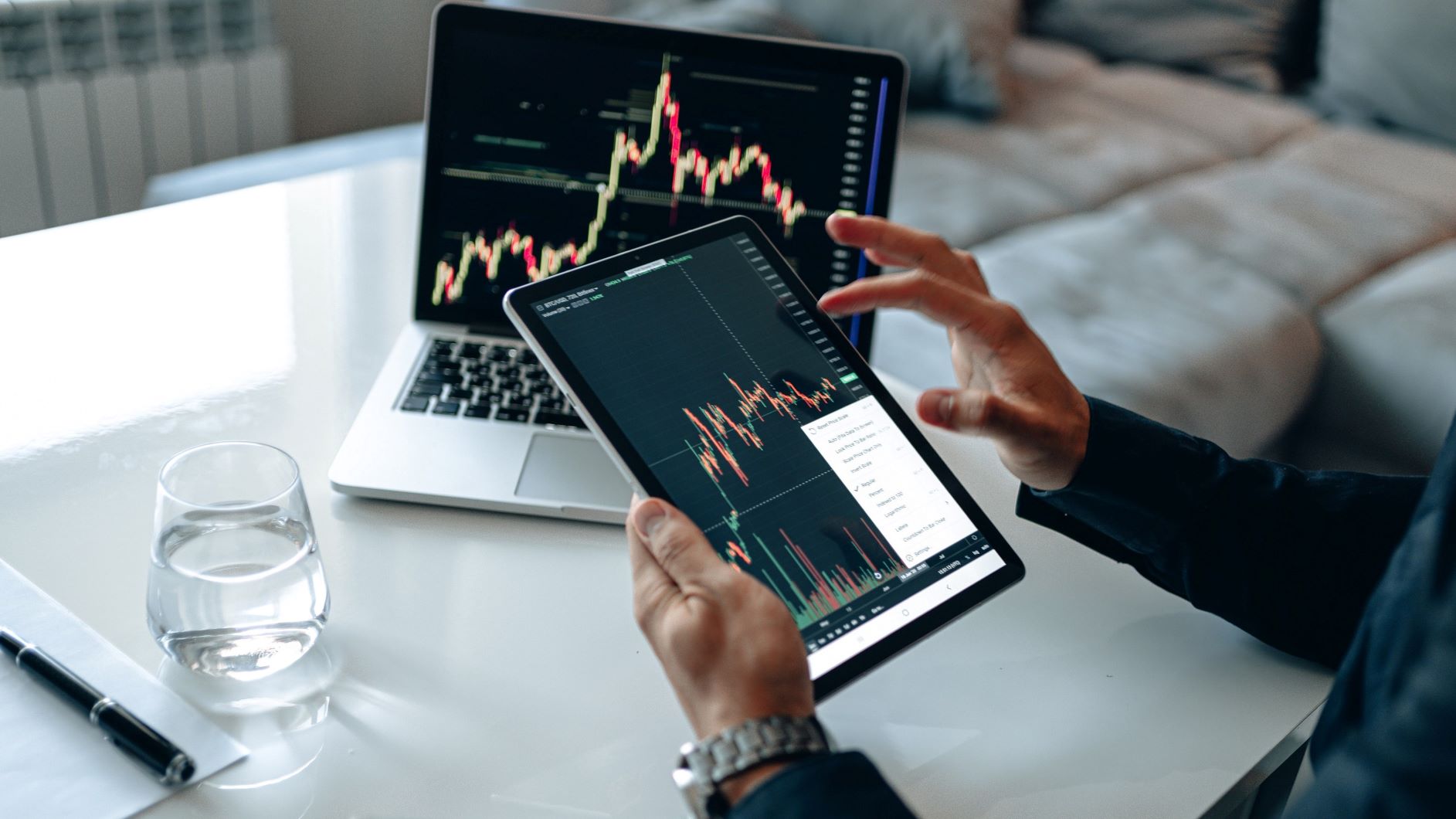 Man using tablet viewing financial data